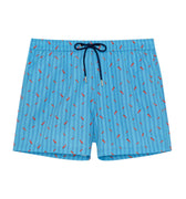 Blue swim shorts with red pepper pattern on a white background